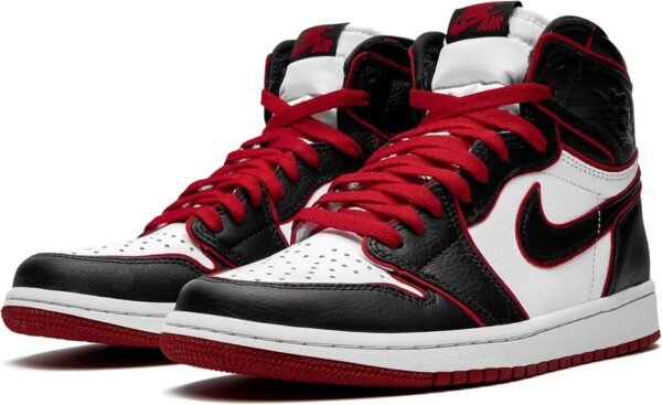 a pair of black and white sneakers