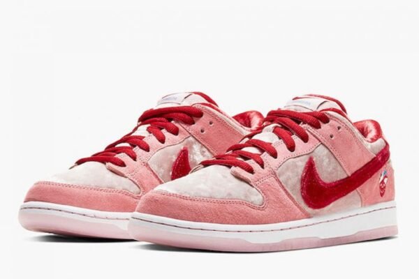 a pair of pink and white sneakers